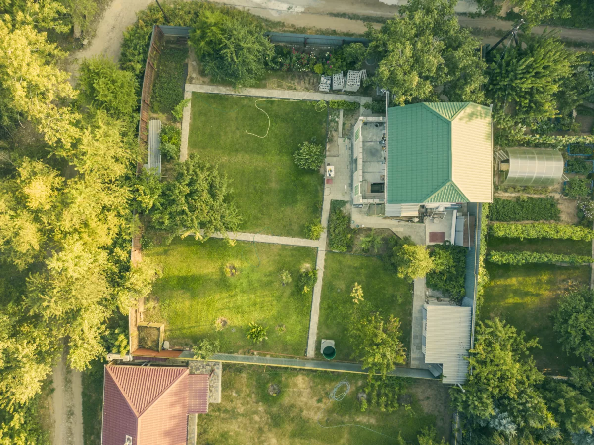 Aerial drone shot summer countryside cottage with garden f