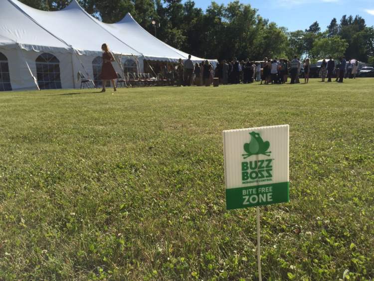 Buzz Boss bite free zone sign on a field where event happening