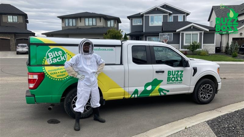 buzz boss worker standing in front of a truck